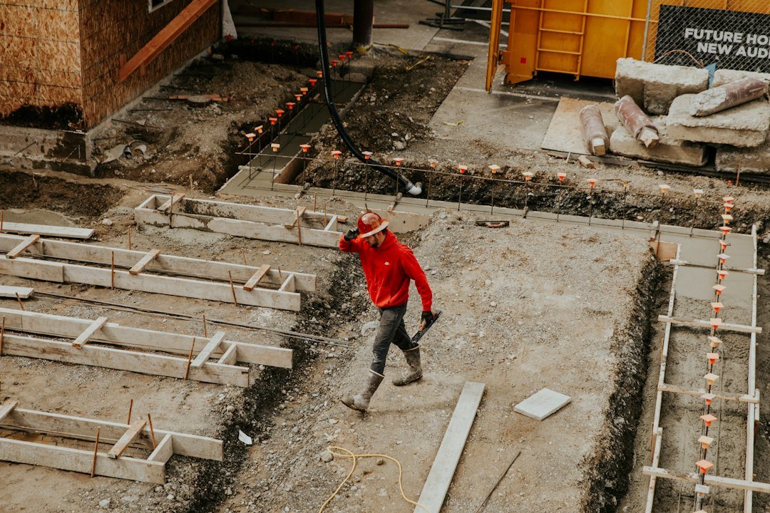 Worker preparing concrete at a construction site