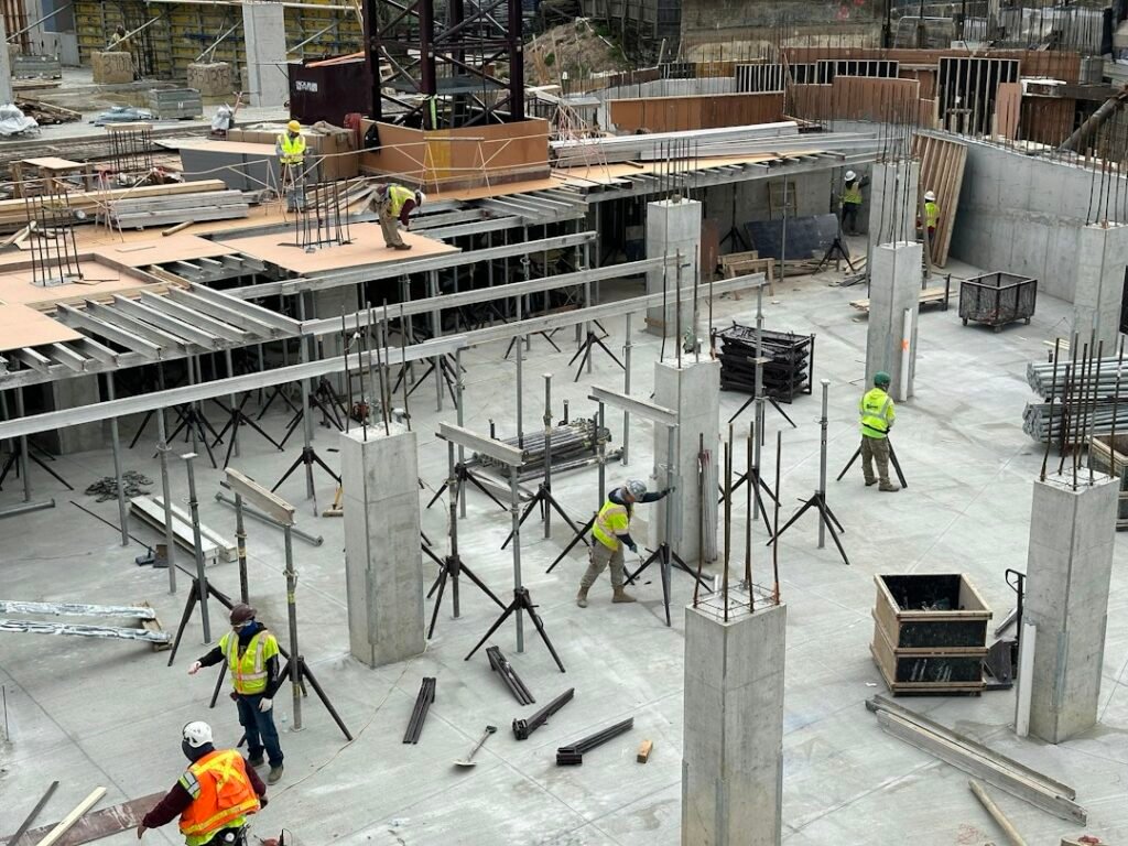 Construction workers at a building foundation site