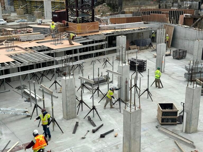 Construction workers at a building foundation site